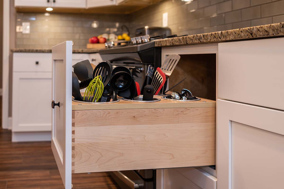 kitchen cabinet drawer with custom utensil holders